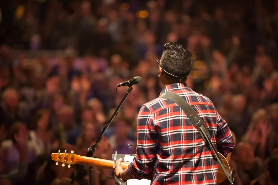Musician with a guitar at a church event